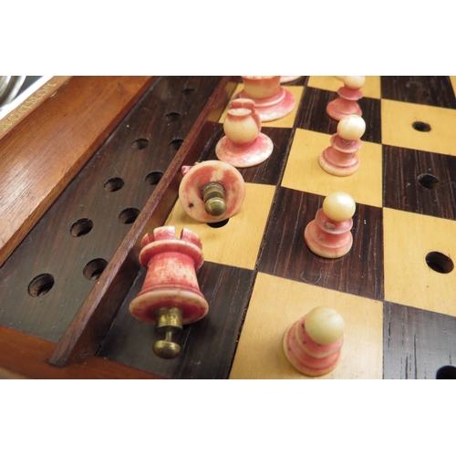 6426 - A Jacques London mahogany cased travelling chess set with stained red bone and natural pieces, gilt ... 