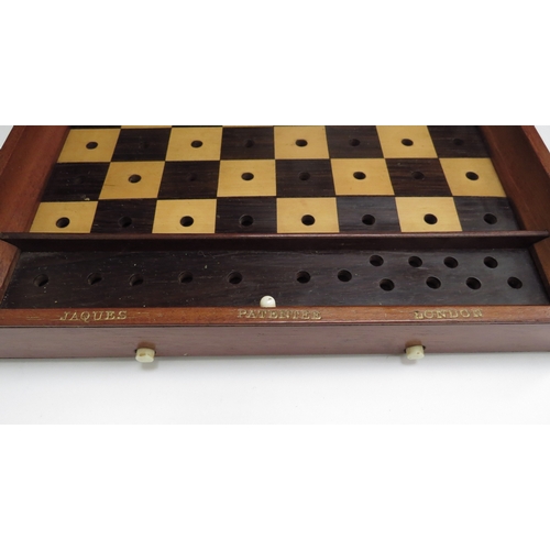 6426 - A Jacques London mahogany cased travelling chess set with stained red bone and natural pieces, gilt ... 