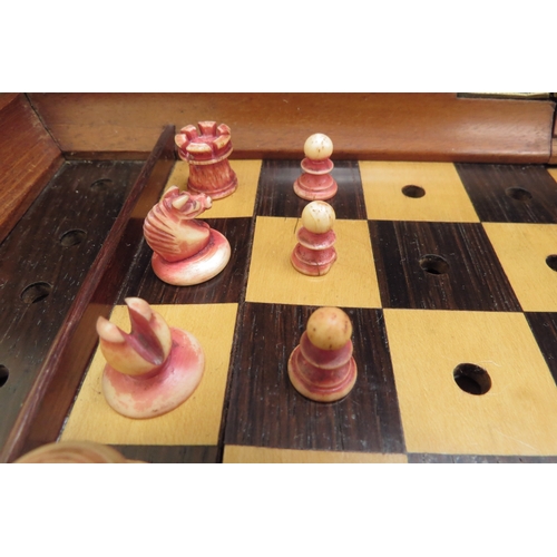 6426 - A Jacques London mahogany cased travelling chess set with stained red bone and natural pieces, gilt ... 