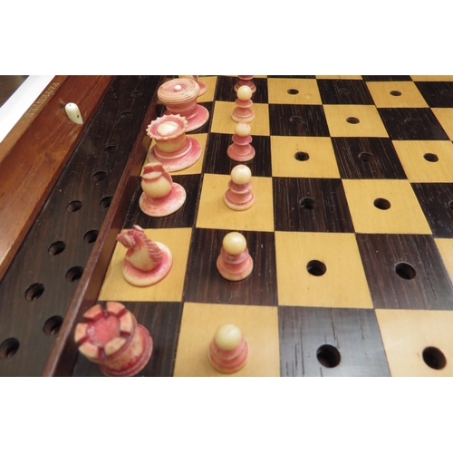 6426 - A Jacques London mahogany cased travelling chess set with stained red bone and natural pieces, gilt ... 