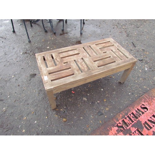 3439 - A teak coffee table