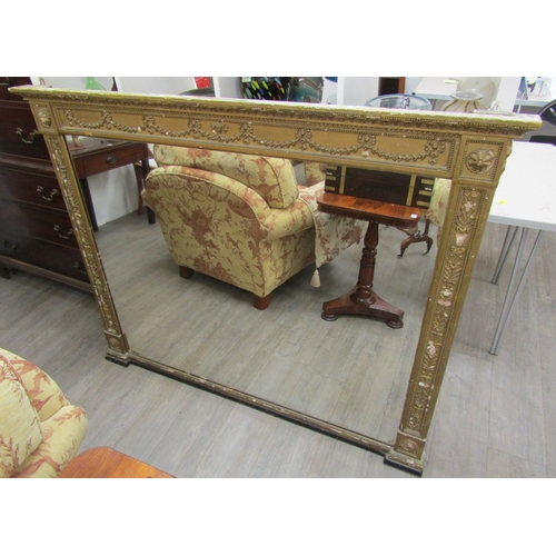 6207 - A 19th century gilt an gesso overmantel mirror with ribbon and swag detail, some gesso elements miss... 