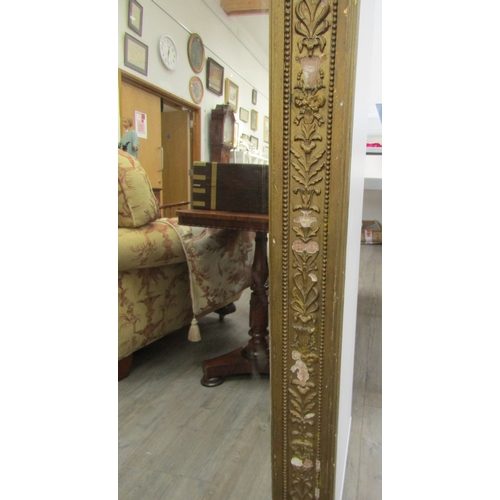 6207 - A 19th century gilt an gesso overmantel mirror with ribbon and swag detail, some gesso elements miss... 