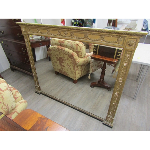 6207 - A 19th century gilt an gesso overmantel mirror with ribbon and swag detail, some gesso elements miss... 