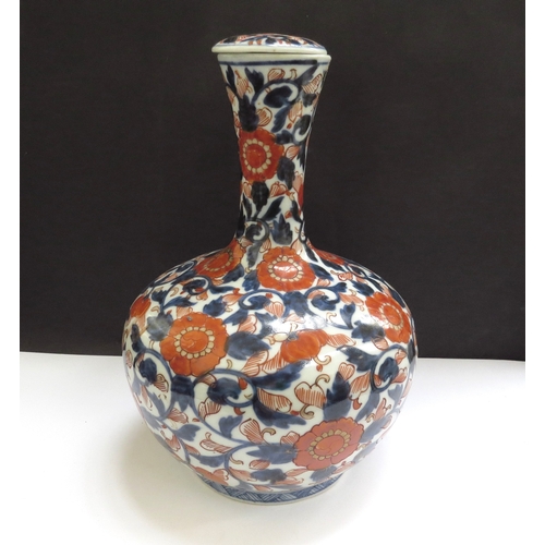 6334 - A 19th Century Chinese Imari decorated vase with lid, 22.5cm tall  (R)  £100