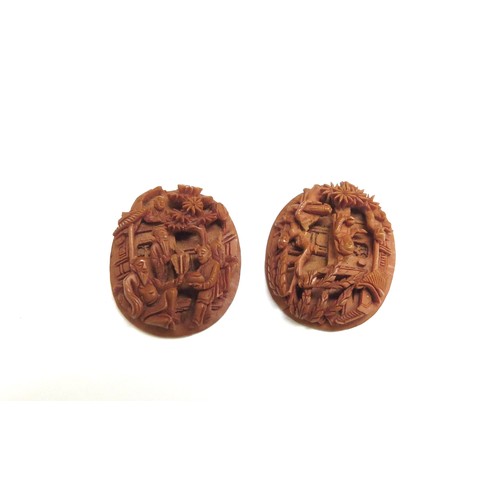 6300 - Two miniature boxwood carved dioramas, 23mm x 16mm