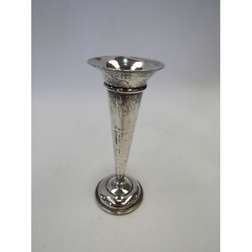 1328 - A small silver weighted vase, 15cm tall