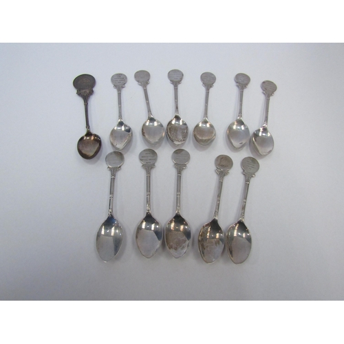 1263 - A collection of silver award spoons, 165g