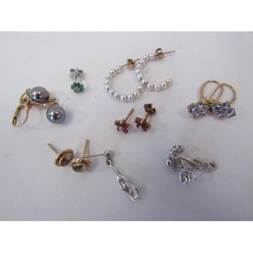 1279 - Seven pairs of 9ct earrings set with various stones including diamond, emerald, tanzanite etc, weigh... 