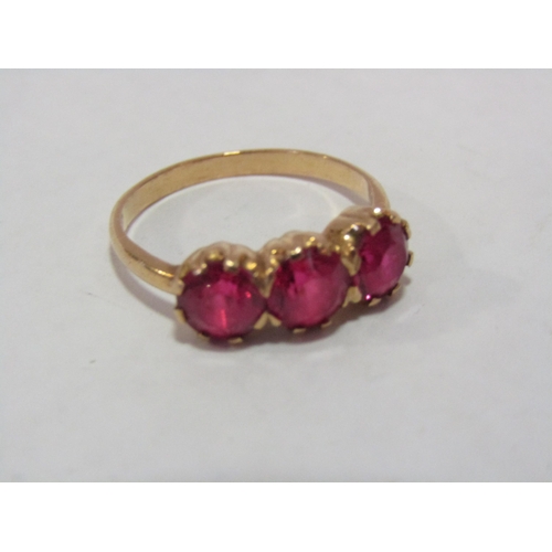 1294 - An unmarked 9ct gold and ruby ring