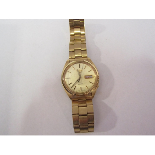 1296 - A Pulsar yellow metal link bracelet gent's watch with a guarantee dated 1988 - boxed