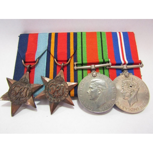 1306 - A WWII medal group of four consisting of 1939-45 and Burma stars, Defence Medal and War Medal