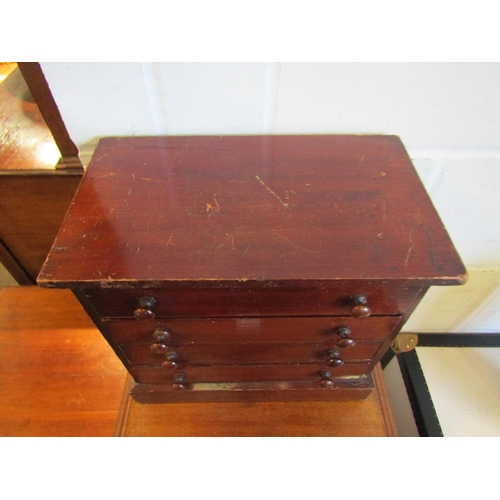 1016 - A table-top collector's cabinet with four glazed drawers, 30cm tall x 33cm wide x 20cm deep