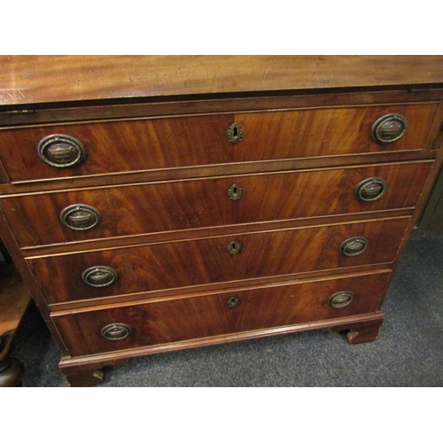 1049 - A 19th Century mahogany bureau, the fall front over four long drawers, oval brass urn relief handles... 