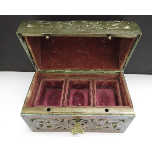 6336 - A domed shaped pierced brass velvet lined perfume casket containing three fitted cut glass perfume b... 