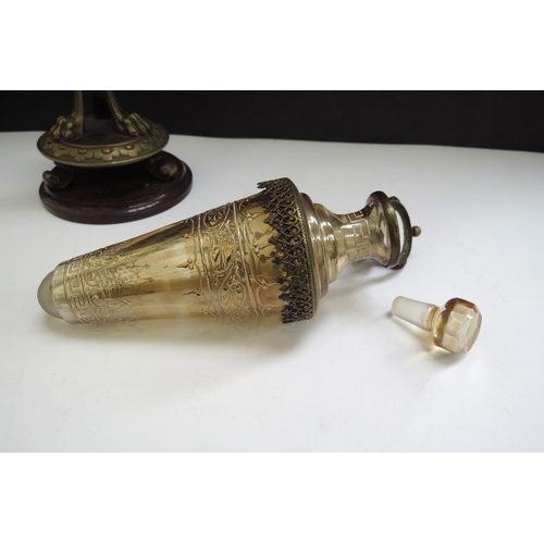 6337 - A cone shaped etched glass perfume bottle in an ormolu support decorated with female caryatids, 23cm... 