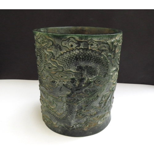 6339 - A Chinese jade brush pot decorated with a Ho-Ho bird and mythical dragon, impressed seal mark to bas... 