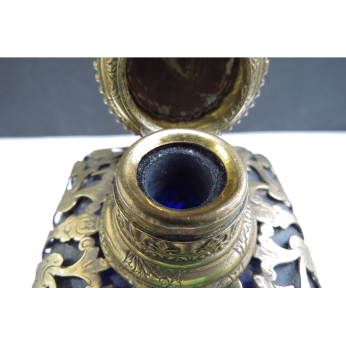 6340 - A Victorian Bristol Blue glass perfume bottle with ormolu overlay, lift up top with inlaid image and... 