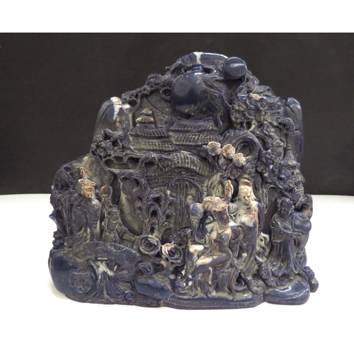 6343 - A Chinese boulder carving depicting a mountain scene, 15cm tall, 18cm wide