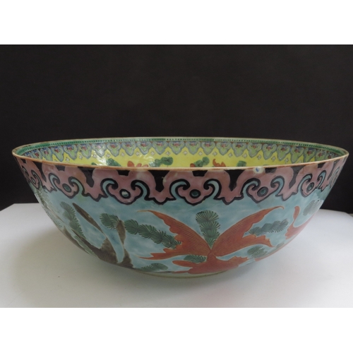 6348 - A 19th Century Chinese bowl decorated with goldfish in vibrant colours, 25cm diameter (chipped)