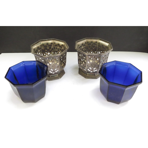 6500 - A pair of Victorian Henry Wilkinson & Co silver pierced condiment pots of octagonal form with blue g... 