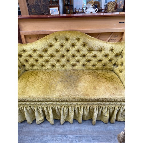 6046A - An early 20th Century gold velour sofa with button back, 90cm x 185cm x 60cm