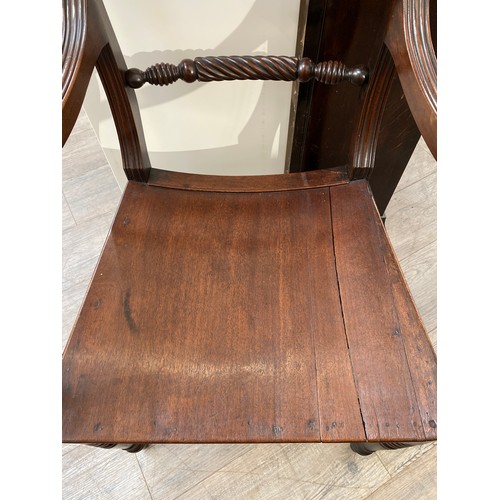 6061 - Circa 1830 an East Anglian mahogany and fruitwood armchair with carved rope twist ring turned back r... 