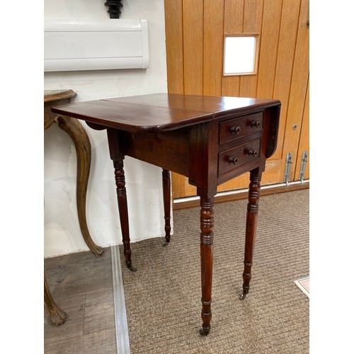 6080 - A Victorian mahogany two drawer drop-leaf work table, on turned supports to castors, 74cm x 31.5cm x... 