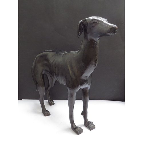 6285 - A cast metal whippet, 28.5cm tall x 36cm long