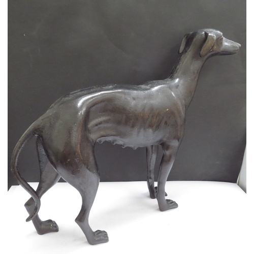 6285 - A cast metal whippet, 28.5cm tall x 36cm long