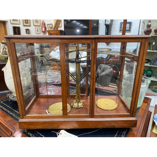 6128 - A vintage set of scientific scales in mahogany case with double door entry, 56.5cm x 70cm x 30cm