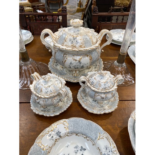 6172 - 19th century Rockingham part dinner service, tureen, sauce tureens, plates, bowls. Two of the meat p... 