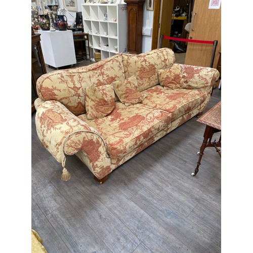 6210 - A Classical style three piece suite with inverted melon fluted legs to castors. the sofa is approx 2... 