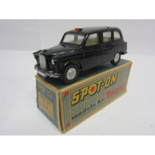 8103 - A Triang Spot-On 155 diecast model Austin Taxi in black, cream interior with red plastic steering wh... 