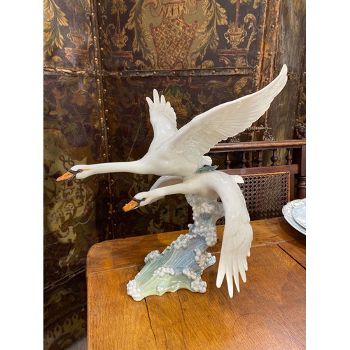 6251 - A figural group of swans by Hutschenreuther, 34.5cm x 33cm