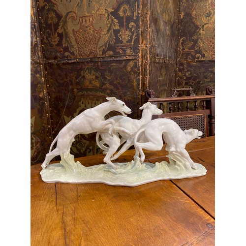 6253 - A figural group of greyhounds by Hutschenreuther, 23.5cm x 49cm long