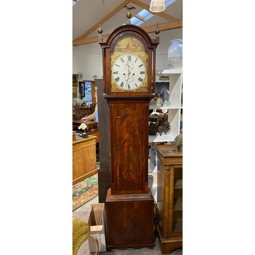 6255 - A Regency mahogany 8-day long case clock, with painted arch dial depicting ruins, Roman numeral dial... 