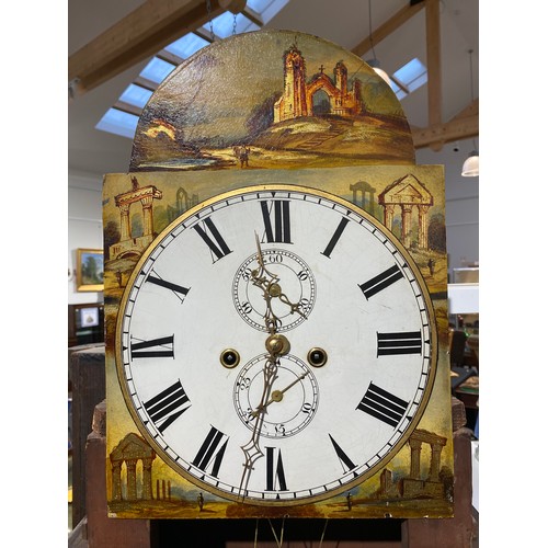 6255 - A Regency mahogany 8-day long case clock, with painted arch dial depicting ruins, Roman numeral dial... 