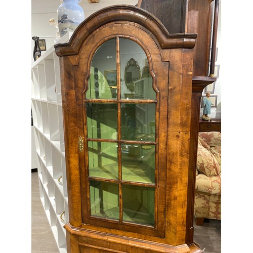 6288 - A walnut Queen Anne style corner cabinet, with arched top, glass panels revealing a painted shelved ... 