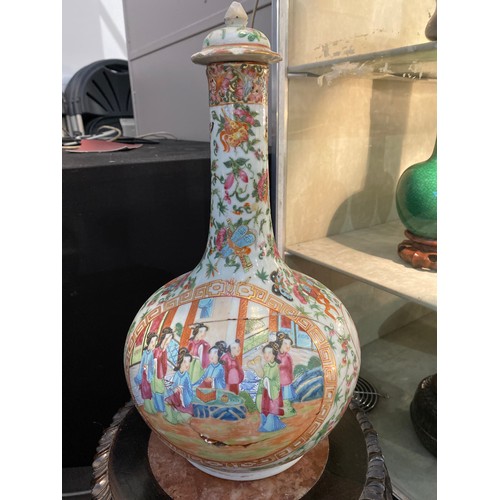 6330 - A late 19th / early 20th Century Chinese Famille Rose pattern bottle vase, restored a/f, 38cm high