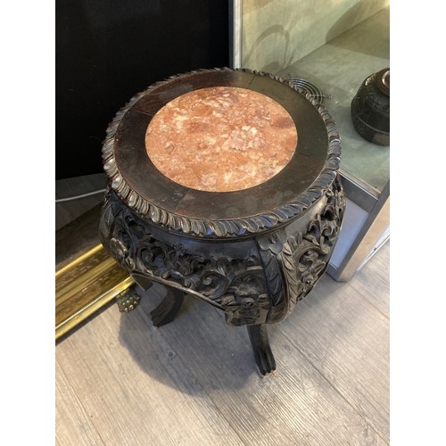 6331 - A 19th Century Chinese carved marble topped occasional table, 48cm tall, the top has a diameter of 2... 