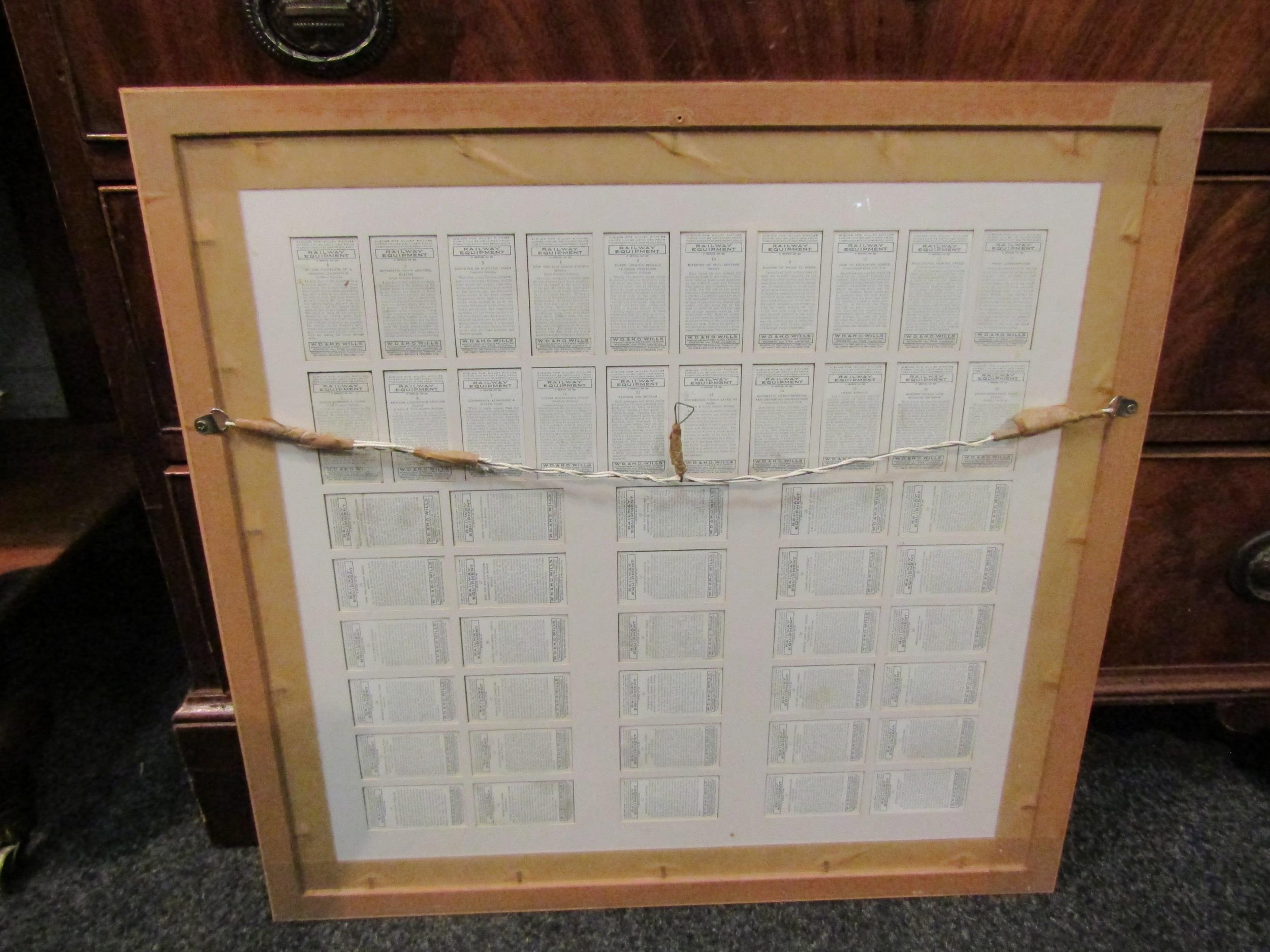 A framed and glazed display of Wills Railway Equipment cigarette cards