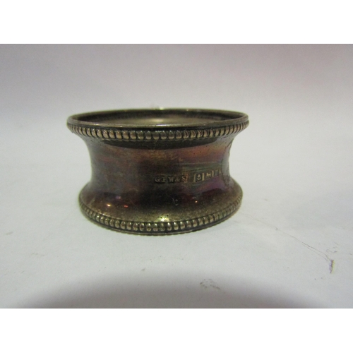 1313 - A silver handled button hook and two silver napkin rings (3)    (R) £15