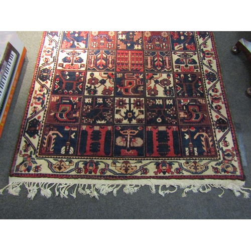 1489 - A Persian Hamedan wool on cotton rug with panelled design, tasselled ends, 250cm x 160cm