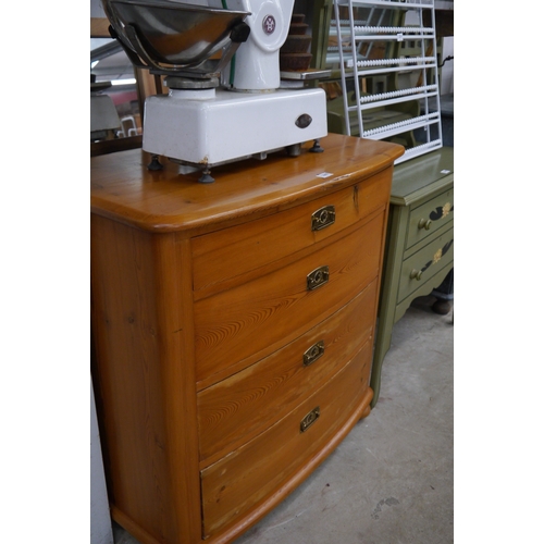 2307 - A pine chest of four bowfronted drawers