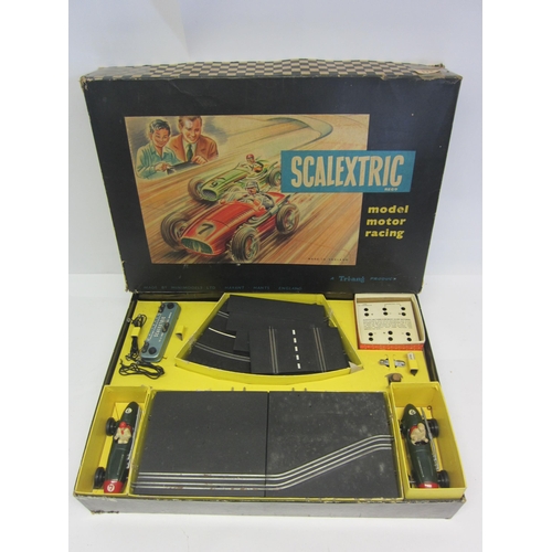 8393 - A boxed 1960s Triang Scalextric Model No.1 slot racing set, comprising two green tinplate number '7'... 