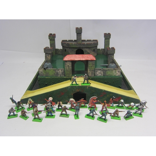 8376 - A painted wooden model fort with metal gun turrets, together with a collection of twenty-eight Brita... 