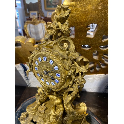 6060 - A mid 19th Century French Raingo Freres ormolu and gilt brass mantel clock, relief moulded Rococo fo... 