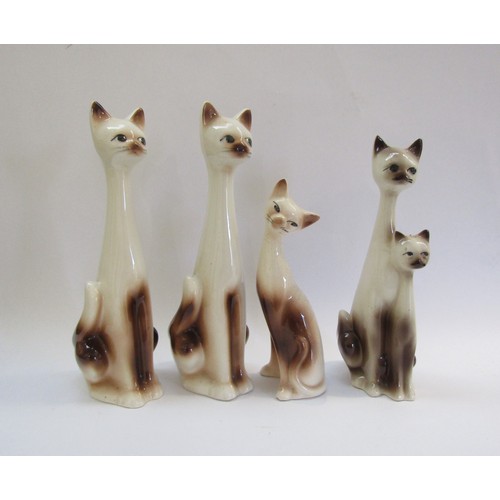 9093 - A collection of four Italian Pottery ceramic cat figure. Tallest 36cm