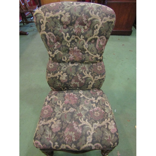 4025 - A Circa 1850 walnut button back tapestry upholstered armchair the serpentine front seat over melon f... 